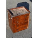 Small Edwardian oak chest of three long drawers with galleried top and turned wooden handles,