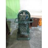 Coalbrookdale style green painted cast iron stick stand, with arched scroll pierced back and