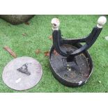 Cast metal boot scraper and lead sundial with Roman numerals (2)