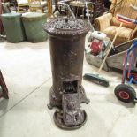Agodin cast iron stove, cylindrical body on three feet, H90cm