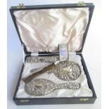 Cased four piece Birmingham silver hallmarked backed dressing table brush and mirror set with