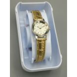 Ladies Citron quartz wristwatch with signed champagne dial, stainless steel case with snap on case