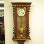 Early C20th Freiburg walnut wall clock, glazed door with flanking fluted columns, 20.5cm dial,