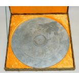 C20th Chinese or Southeast Asian archaic style carved stone disc, in yellow velvet lined