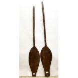 Two African carved hardwood paddles, L124cm (2)