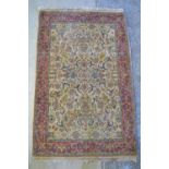 Multicoloured Persian style rug, floral field on ivory ground within red repeating border W160cm x