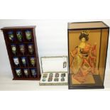 Twelve cloisonne beakers, H7cm, with stands, in wooden display unit, H50.5cm, a boxed set of eight