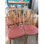 Set of four Windsor type dining chairs with Fleur De Lis splat