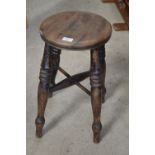 Late Victorian Elm and Beach stool, circular top four turned and ringed legs with X shaped stretcher