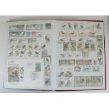 Three albums of GB and commonwealth mint and used commemorative stamps, with a small selection of