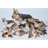 Collection of ceramic Alsatian ornaments and figures from various manufacturers including Robert