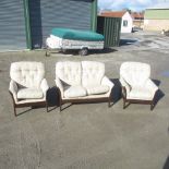 Contemporary stained framed cottage suite, with loose back and seat cushions upholstered in floral