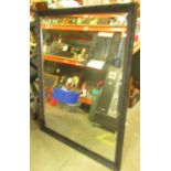 C20th bevelled mirror in ebonised swept and moulded frame W99cm x H128cm