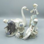 Royal Copenhagen figure of a woman feeding a cow, printed marks, 3 Lladro figures and a Nao