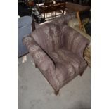 C20th Two seater mahogany framed sofa with scroll arms and curved raised back in patterned demax and