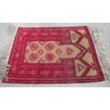 Small Persian pattern red ground Prayer rug, geometric medallion field in multi striped border