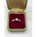 18ct yellow gold diamond solitaire ring with diamond set shoulders, stamped 750, size M, 2.9g