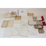 Collection of loose world stamps in envelopes with three small folders