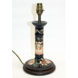 Moorcroft Hibiscus pattern table lamp on turned moulded base, hand painted serial no. to the