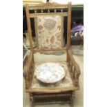 Late Victorian beech framed rocking chair with upholstered galleried back and seat