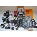 Collection of equipment for Canon digital SLR cameras including Nissin TTL flash, various lens