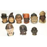 Nine continental novelty figural tobacco jars modelled as human heads, in the manner of Bernard