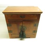 Late C20th Chinese oriental hardwood table cabinet, frieze drawer over two doors, H40.3cm x W40cm