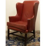 George III upholstered armchair, wing back with outsplayed arms and loose seat cushion, brass nail