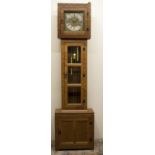 Peter "Rabbitman" Heap of Wetwang - an adzed panelled oak long cased clock, square hood with