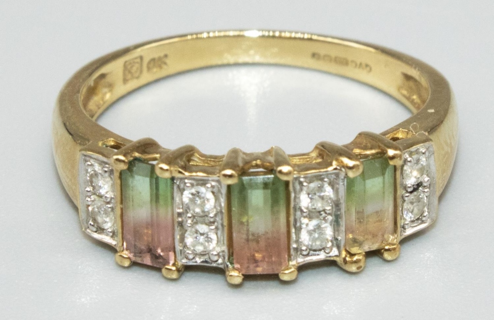 9ct yellow gold ring set with three baguette cut watermelon tourmalines and eight brilliant cut