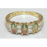9ct yellow gold ring set with three baguette cut watermelon tourmalines and eight brilliant cut
