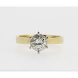 18ct yellow gold diamond solitaire ring, the round cut diamond in a white gold Tiffany style
