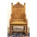 Victorian Gothic oak throne type chair, planked back with angular arched cresting, scrolled arms