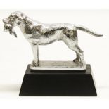 Chromed metal car mascot in the form of a Labrador retrieving a pheasant, stamped on base Made In