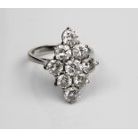 18ct white gold diamond cluster ring, the nine brilliant cut diamonds in claw settings on plain