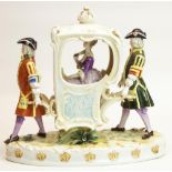 Continental porcelain model of a young girl in a sedan chair supported by two porters, on oval