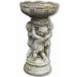Composite stone birdbath, circular leaf cast bowl supported by three cherubs, on stepped base, D50cm