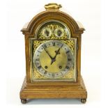 Winterhalder and Hofmeier C20th golden oak arch top bracket clock, with brass carrying handle,