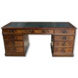 Adam Richwood - a George III style mahogany twin pedestal desk, with inset gilt tooled top, three