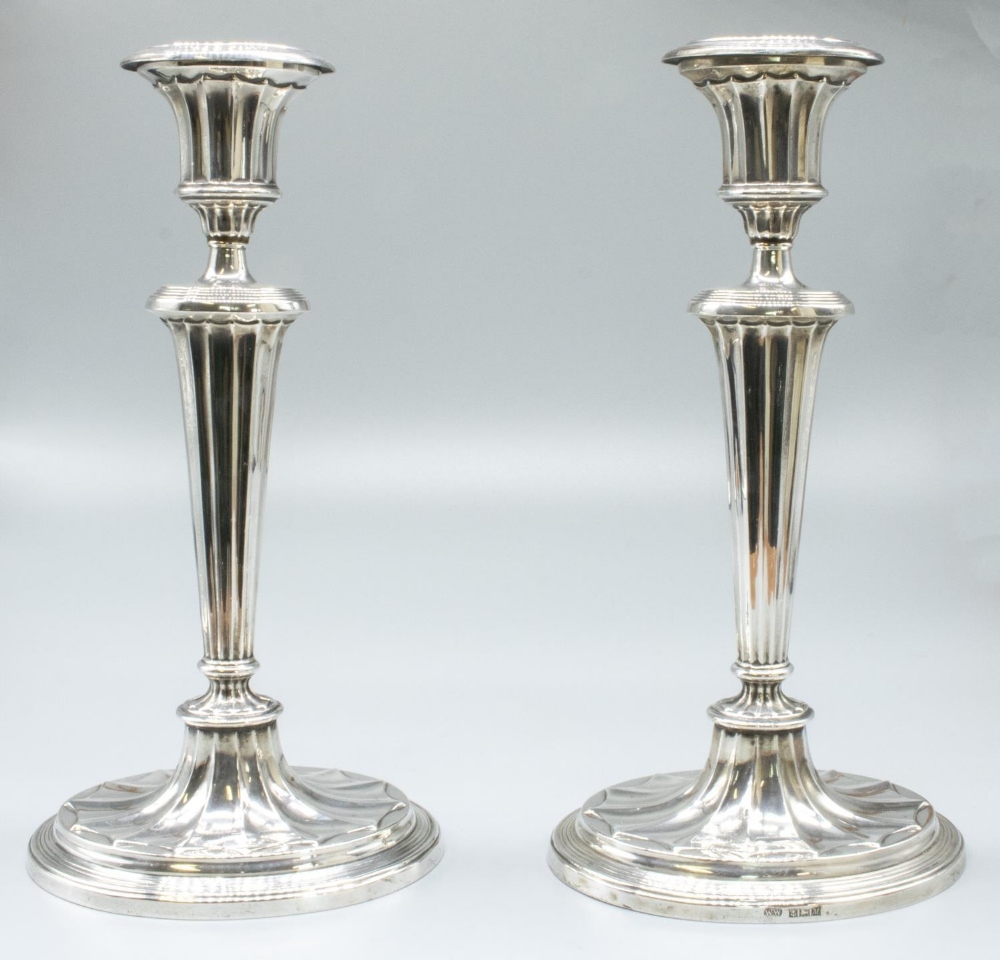 Pair of ER.ll hallmarked Adam style silver candlesticks, fluted urn sconces on reeded columns,