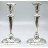 Pair of ER.ll hallmarked Adam style silver candlesticks, fluted urn sconces on reeded columns,