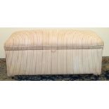 Large ottoman with hinged top, upholstered in red striped fabric on casters, W126cm D63cm H55cm
