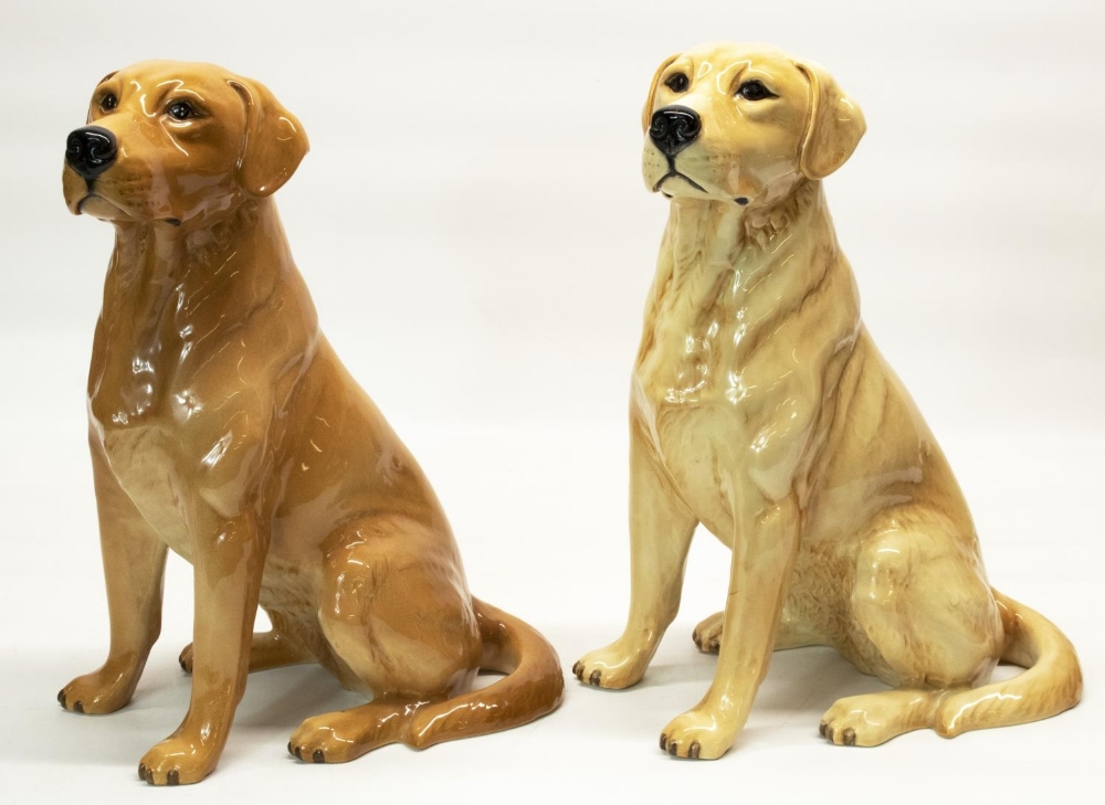 Two large Beswick fire side models of seated yellow and red Labradors, both No. 2314, impressed