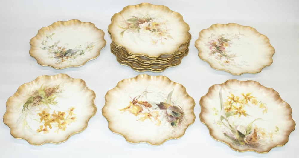 Set of thirteen Doulton Burslem cabinet plates, painted with sprays of wild flowers within waved