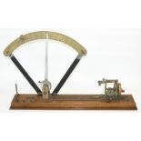 James Heal & Co. Halifax, a brass and cast iron yarn tester, on rectangular mahogany base, L65cm