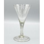 Georgian wine glass, trumpet bowl on tapered stem with tear drop inclusion and stepped concave