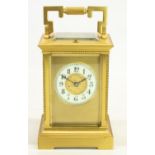 C19th French brass cased Carriage clock, bevelled glass panels with beaded column detail, white