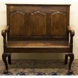 Small stained as oak pine settle, raised back with moulded top rail above three fielded panels,