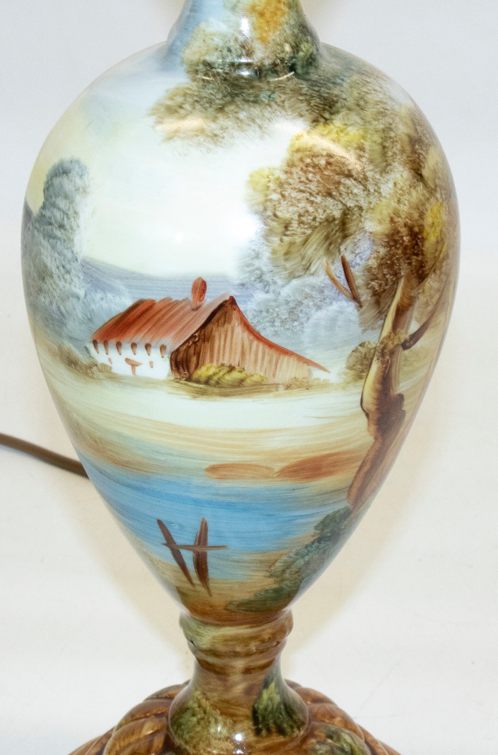 Continental porcelain table lamp, circular tapering body painted with cottage in wooded river - Image 2 of 2