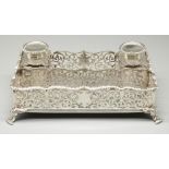 Late Victorian hallmarked silver rectangular inkstand, scroll pierced gallery with gadrooned rim, on